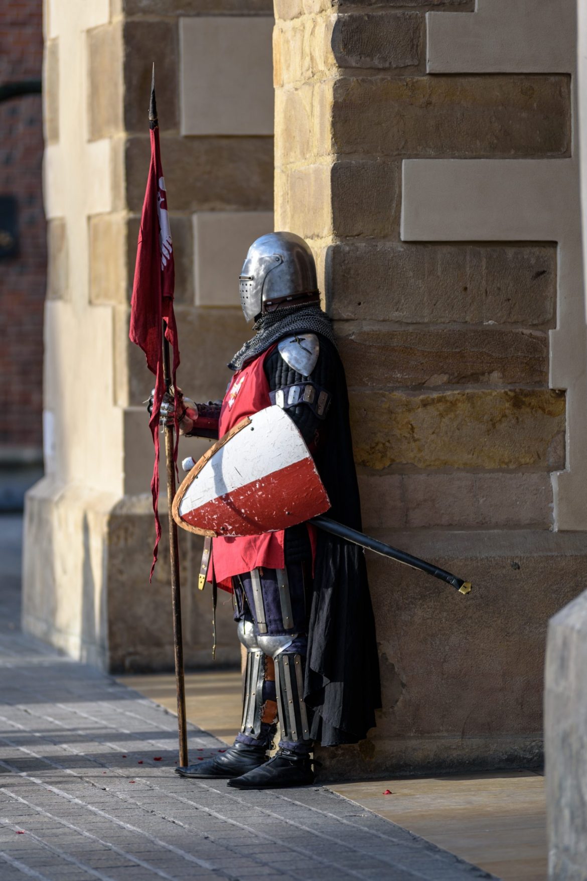 man-wearing-gray-and-red-armour-standing-on-the-streets-226746-scaled-1.jpg